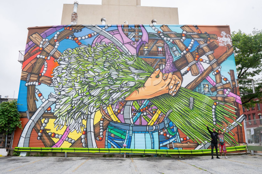 The Grand Street BID added murals in the district, including "Olor a Azucenas el Perfum del Barrio" by Don Rimx.